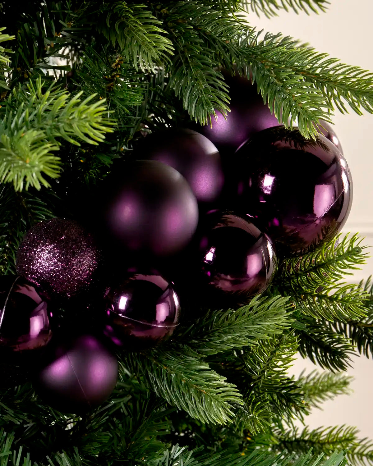 Close-up of purple baubles in a Purple Bauble Cluster Arch