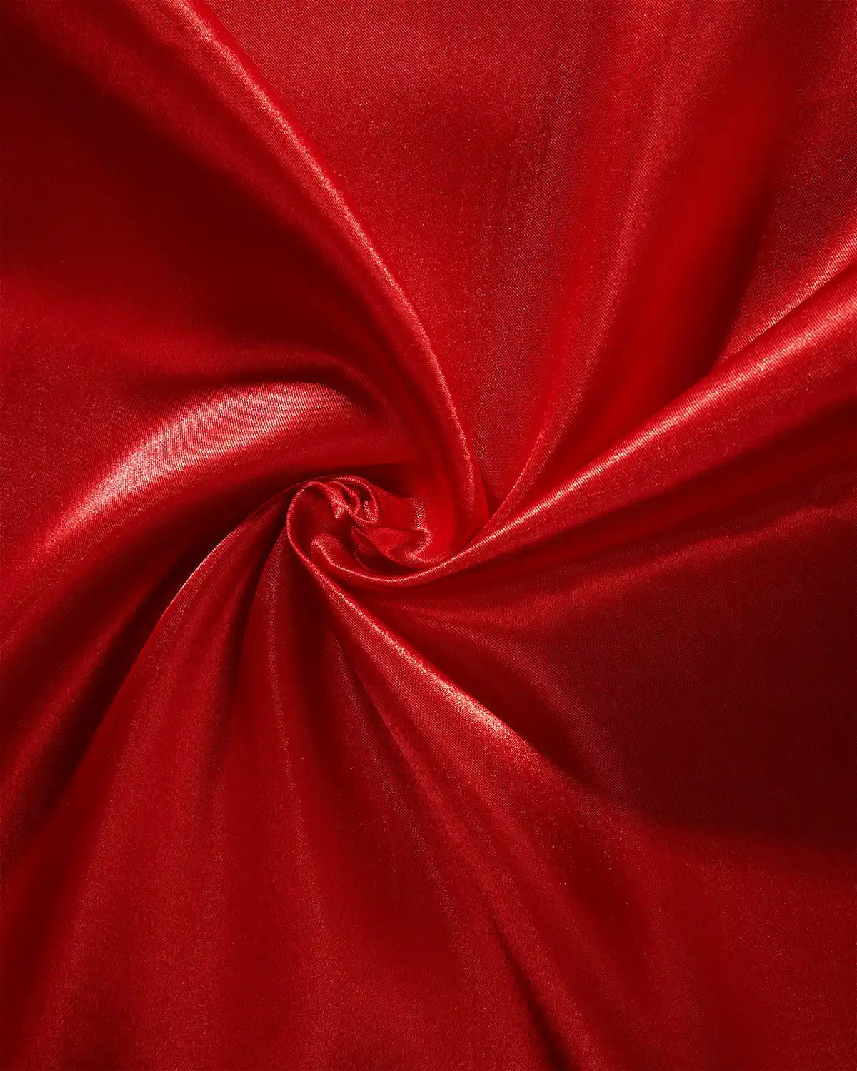Close-up of red fabric with a swirl pattern