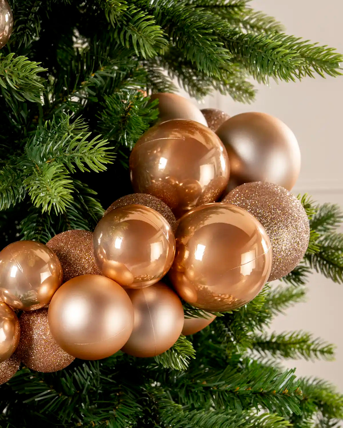 Close-up of rose gold baubles in a Rose Gold Bauble Cluster Arch