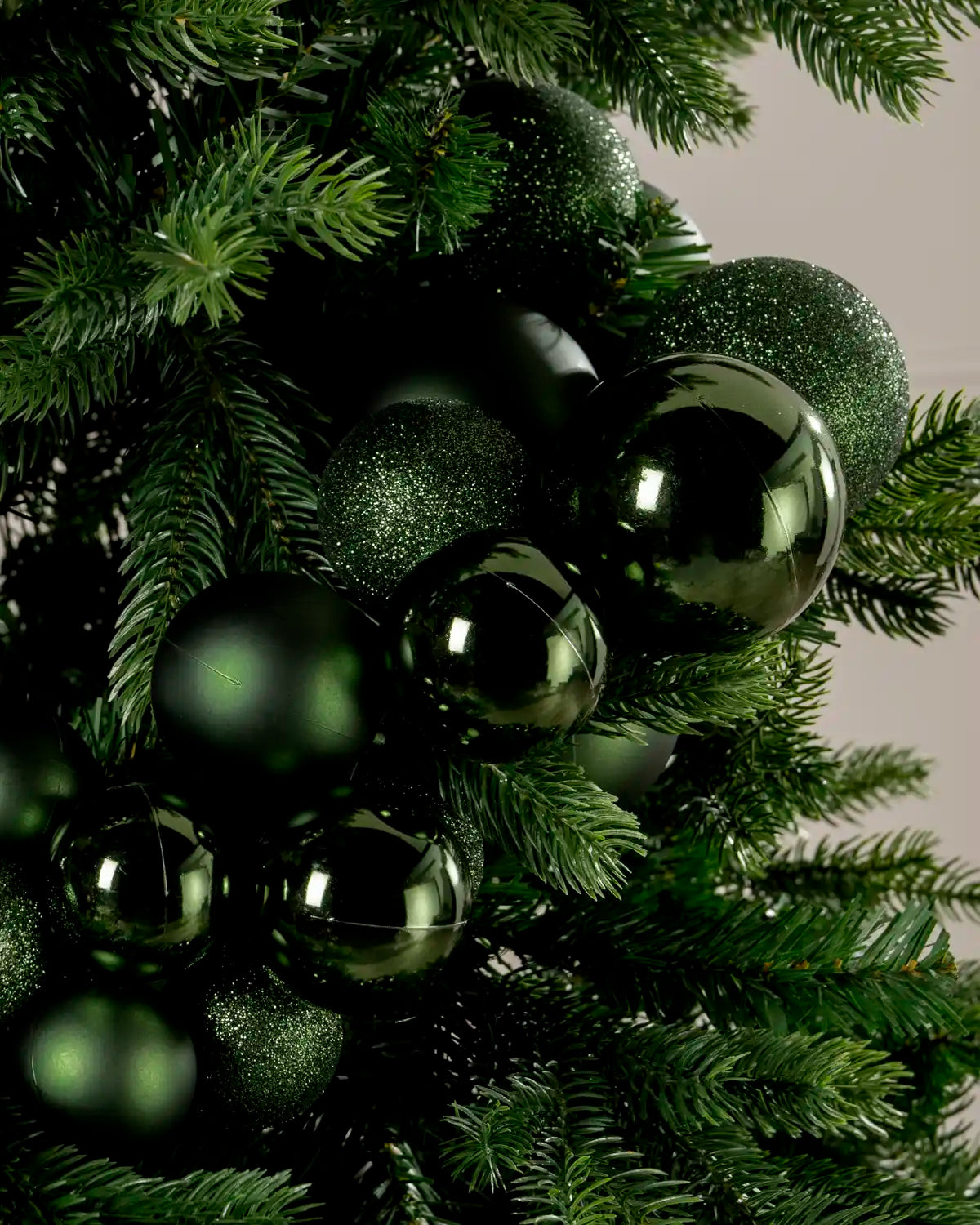 Close-up of sage green baubles in a Sage Green Bauble Cluster Arch