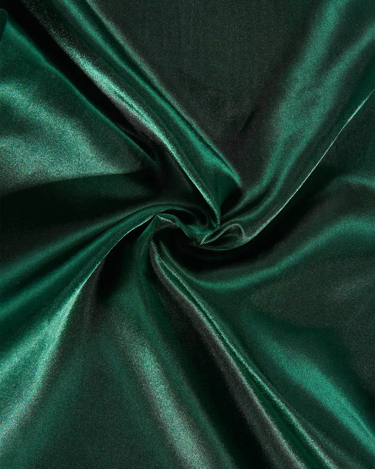 Close-up of sage green satin fabric with swirl pattern