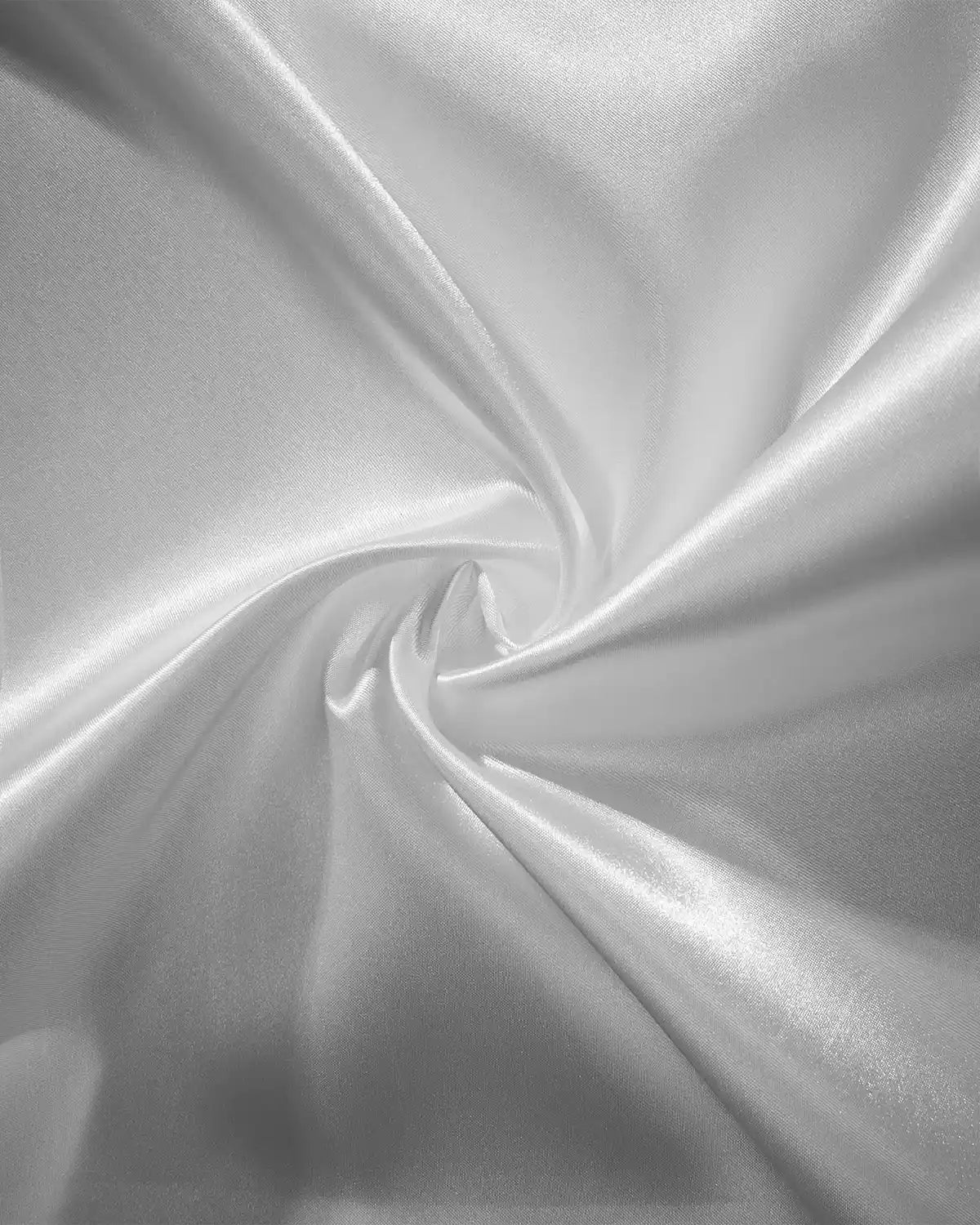 Close-up of silver satin fabric in a swirl pattern