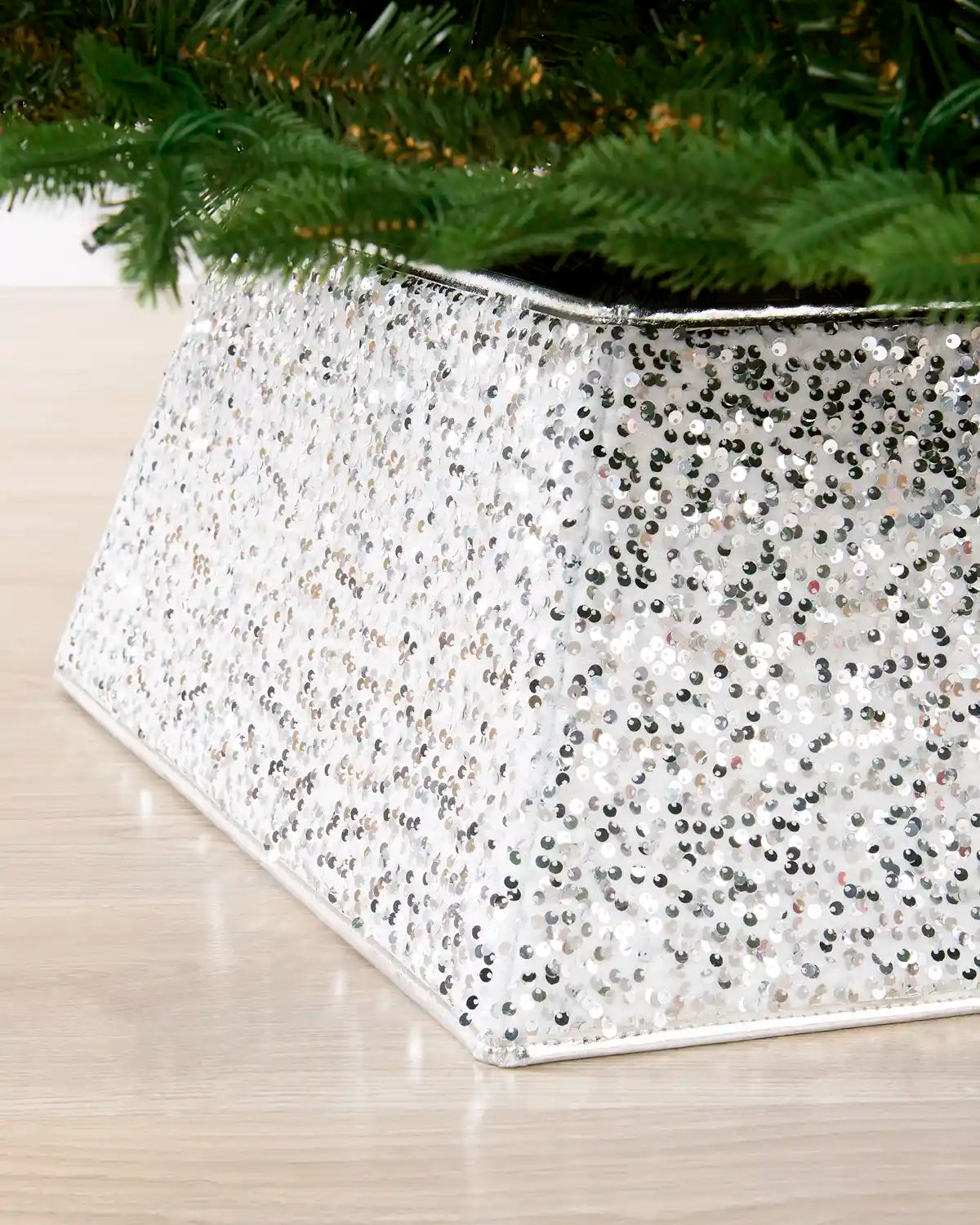 Close-up of silver sequin detailing on the Christmas tree collar