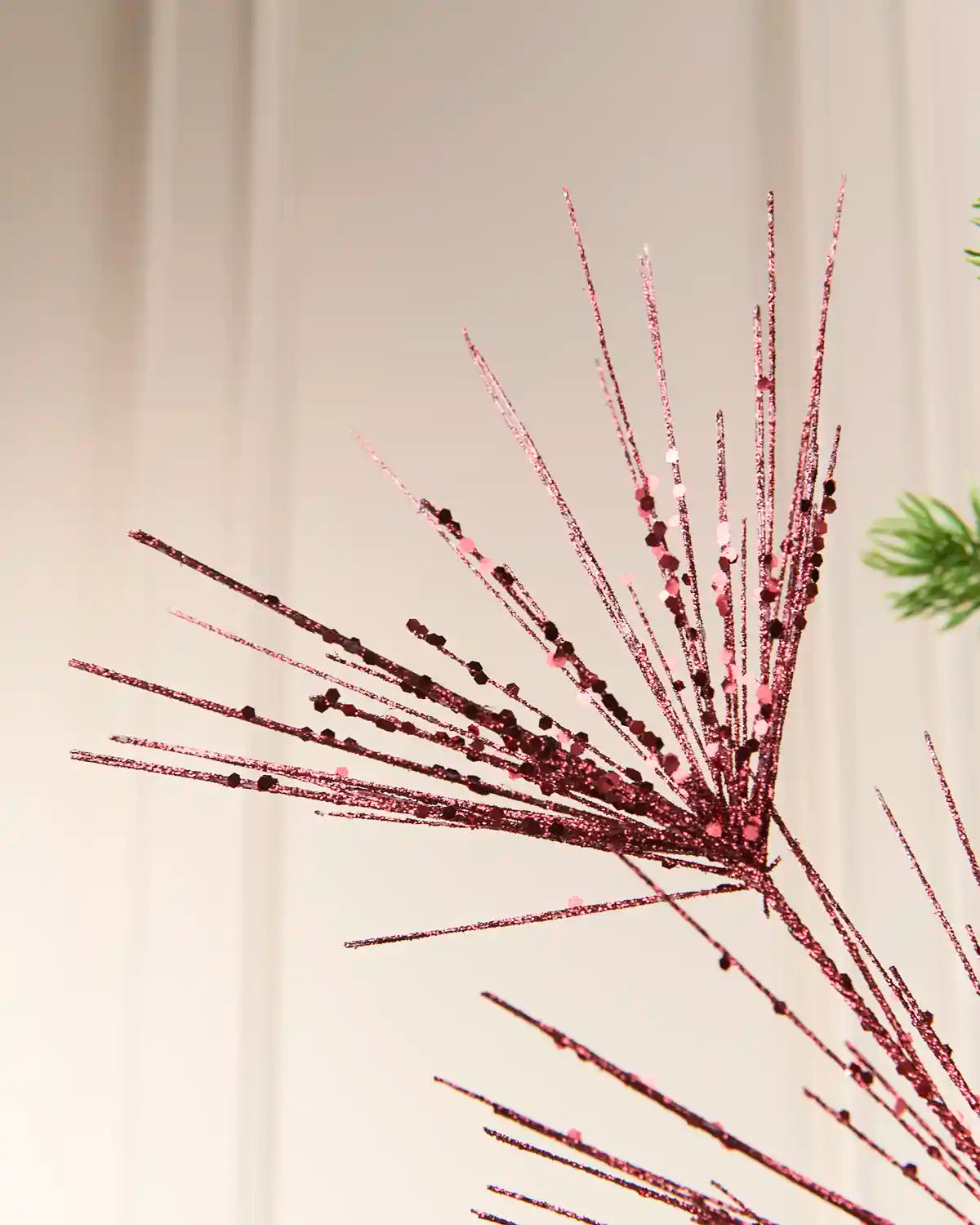 Close-up of the Burgundy  Glitter Firework Spray, showing thin glitter-covered stems
