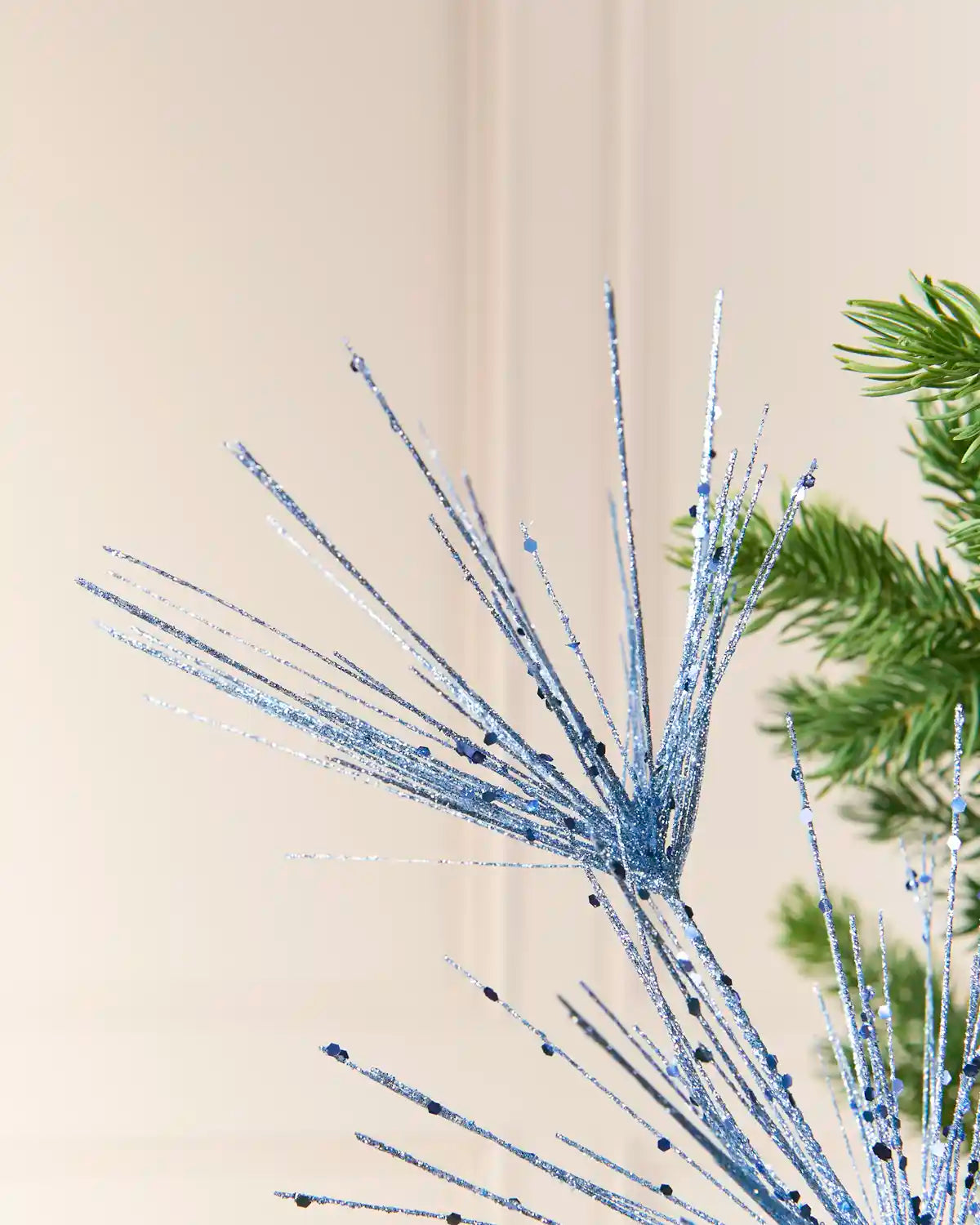 Close-up of the Ice Blue Glitter Firework Spray, showing thin glitter-covered stems
