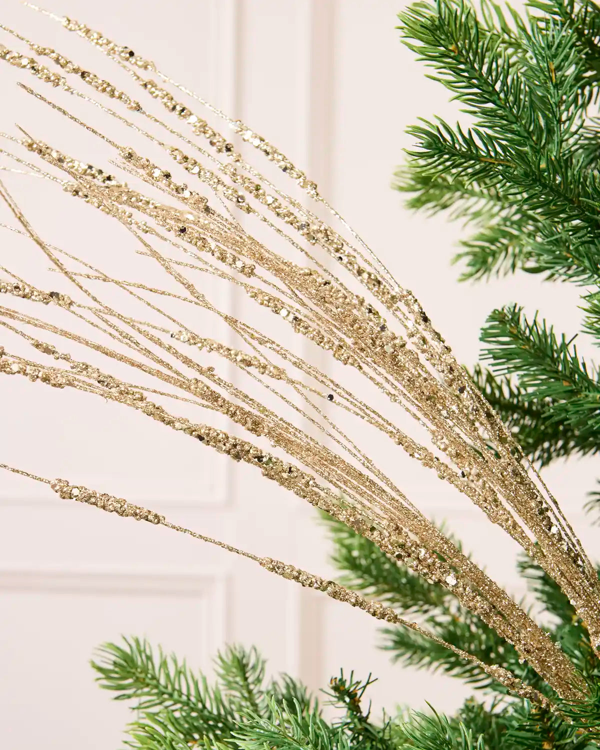 Close-up of the Latte Glitter Wispy Spray, showing textured glitter-covered stems and clustered decorative details
