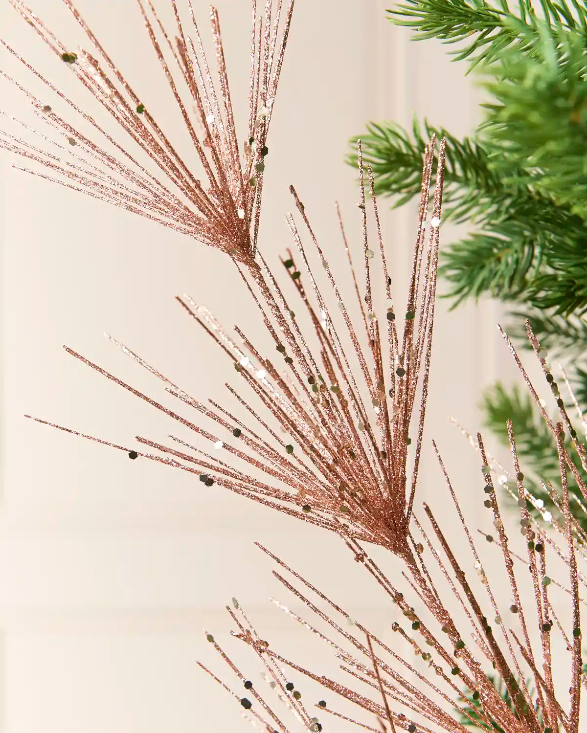 Close-up of the  Rose Gold  Glitter Firework Spray, showing thin glitter-covered stems
