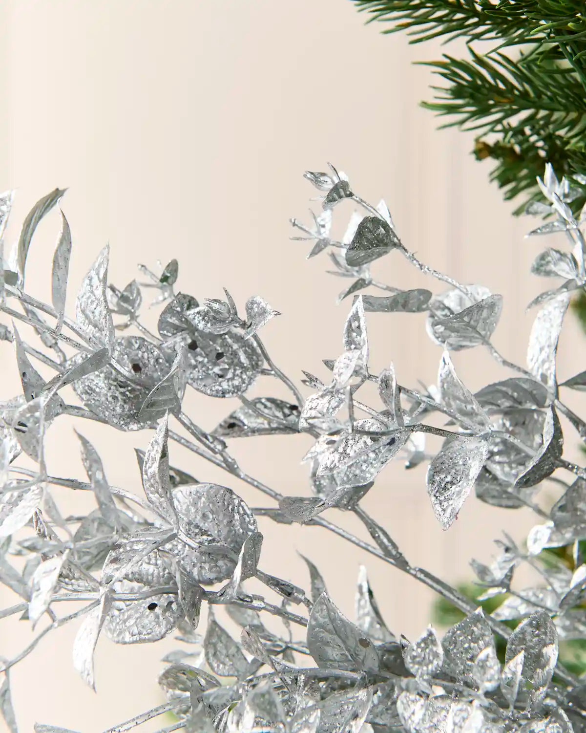 Close-up of the Silver Foliage Spray highlighting its textured metallic Silver leaves and branching stems
