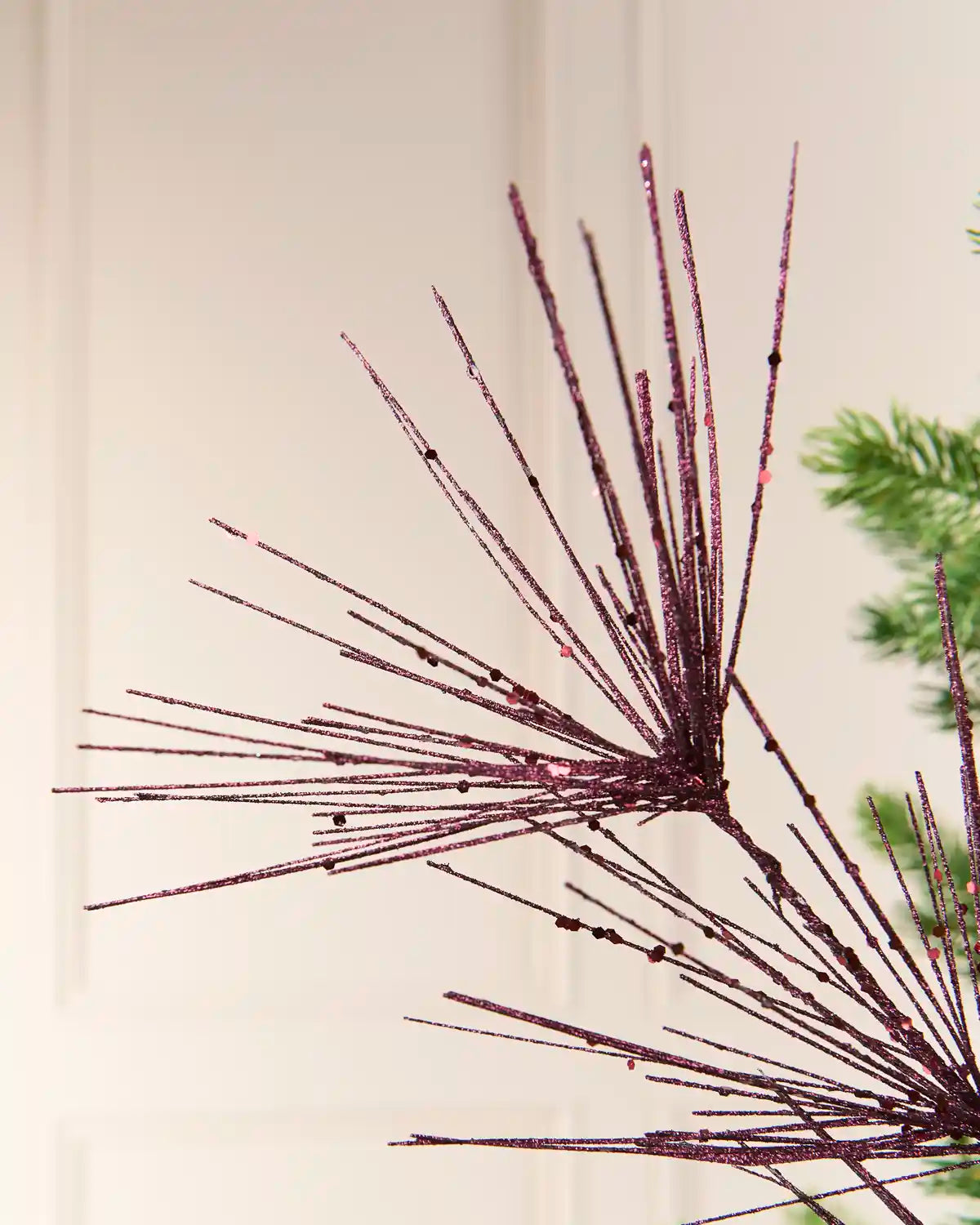 Close-up of the purple Glitter Firework Spray, showing thin glitter-covered stems