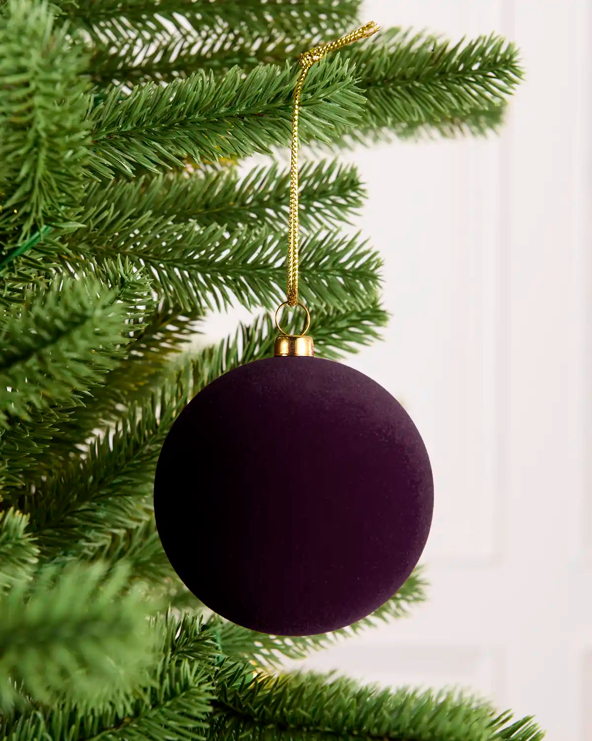 Close-up of traditional round purple velvet bauble