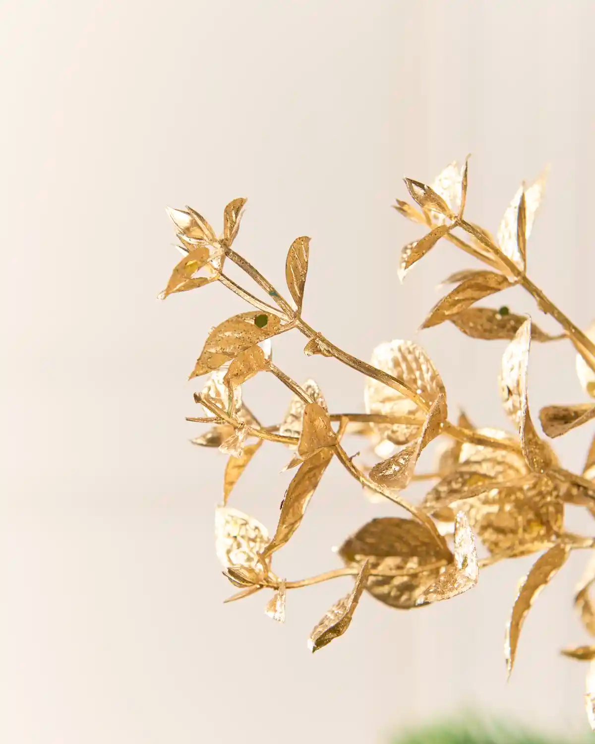 Close-up view of the Gold Foliage Spray showing individual gold leaves and fine branching details