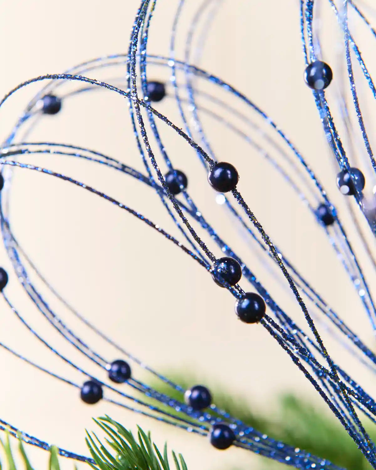 Close up Navy Glitter Nest Christmas Tree Pick showing the glitter details and Navy balls