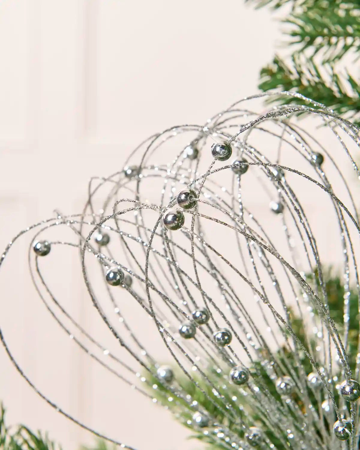 Close up Silver Glitter Nest Christmas Tree Pick showing the glitter details and Silver balls.

