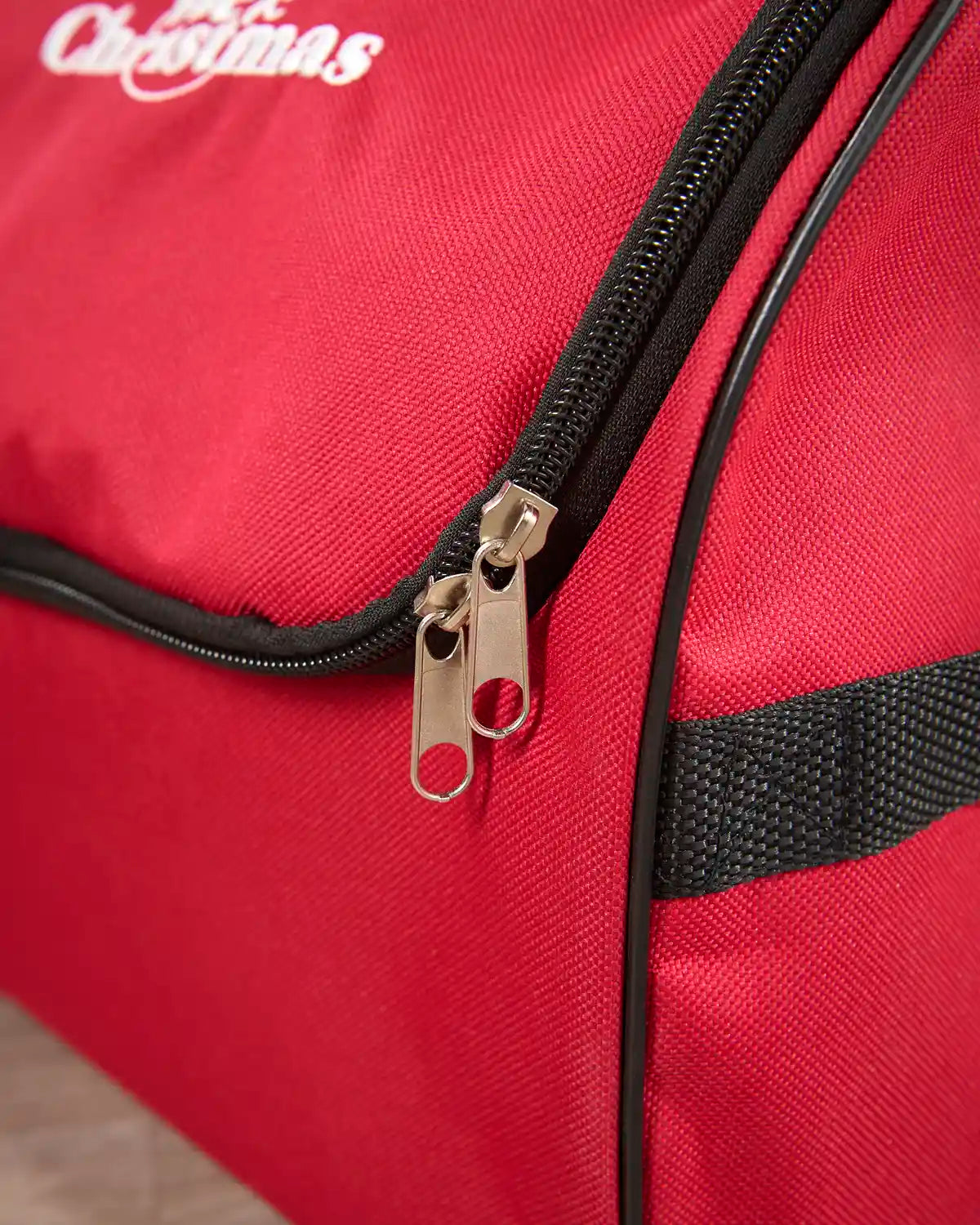 Close up of red Fairy lights storage bag with Black trim and silver Zipper