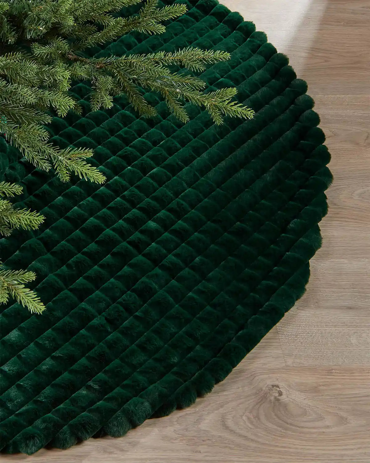 Close-up of sage green faux fur diamond tree skirt edge, highlighting the soft texture of the skirt itself