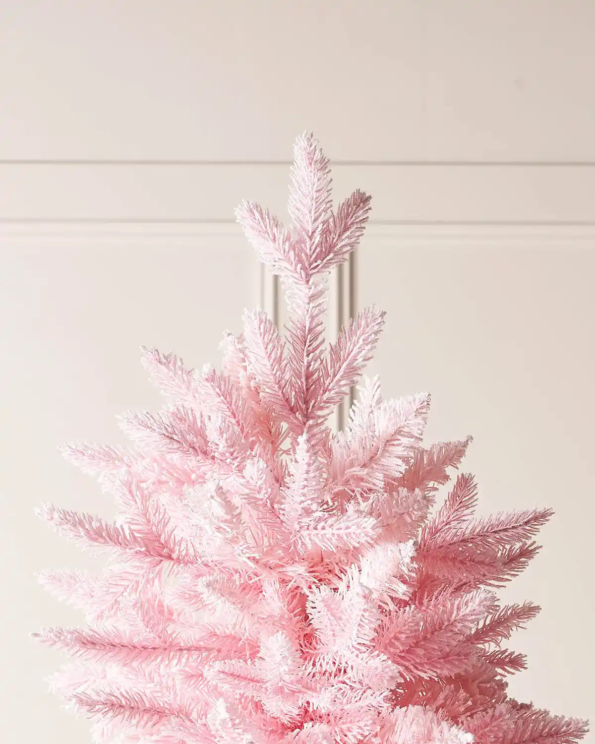 Close up of the top of a Pink Artificial Christmas tree showing the Pink PVC and PE tips