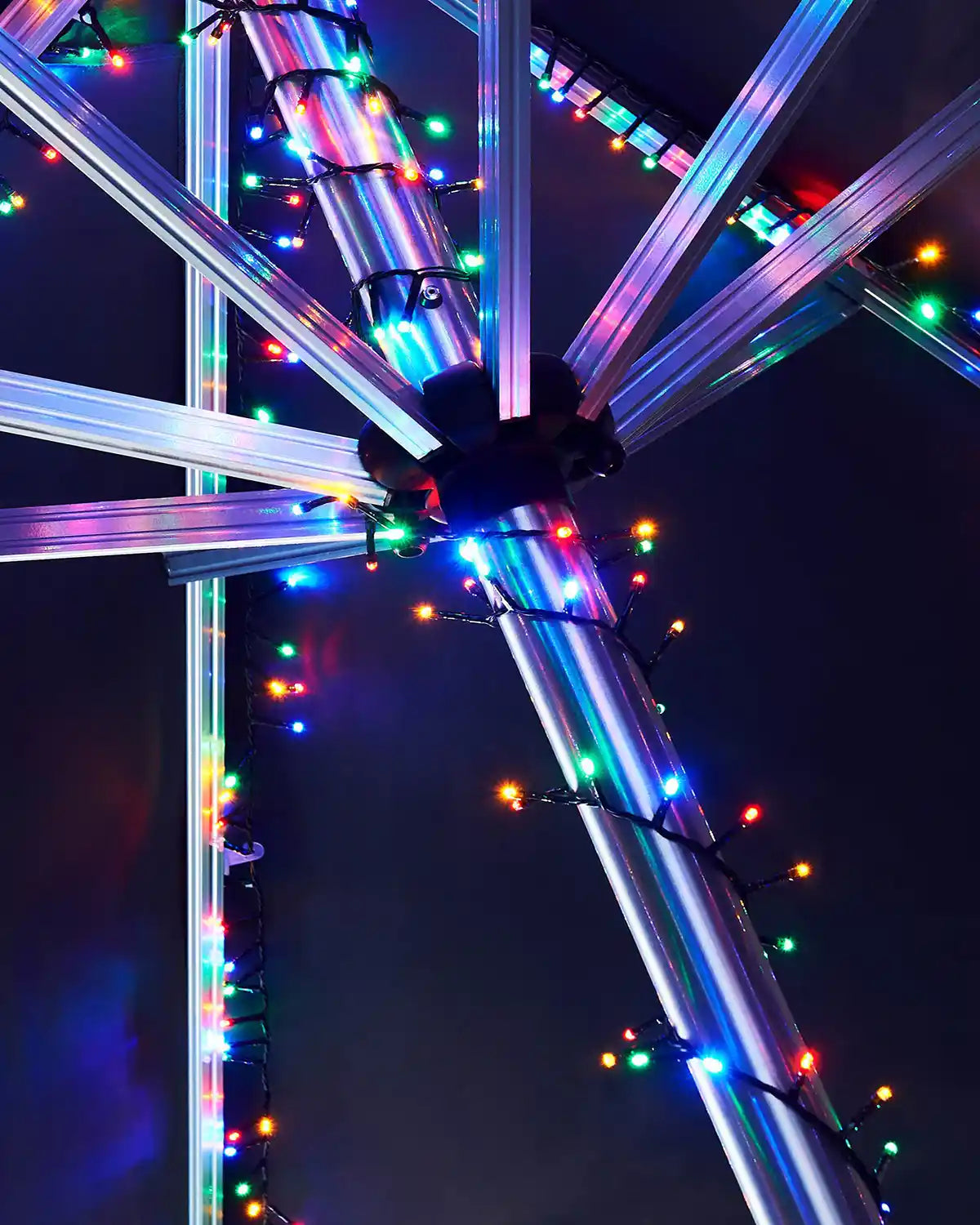 Colourful LED lights on a metal frame against a dark background