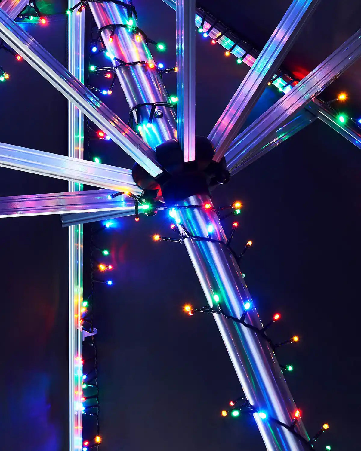 Colourful LED lights on a metal frame against a dark background