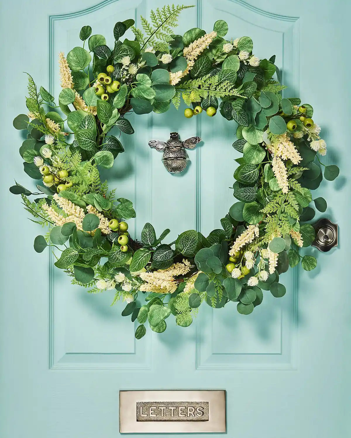 Cream, 28 Inch, Artificial Floral Eucalyptus Spring Wreath,  on a Turquoise door.