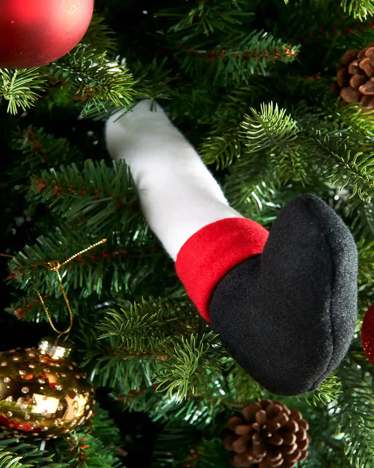 Close up of Snow man leg with Black boot on a Christmas Tree with red and gold baubles for DIY Snowman Tree Decoration, 40 cm
