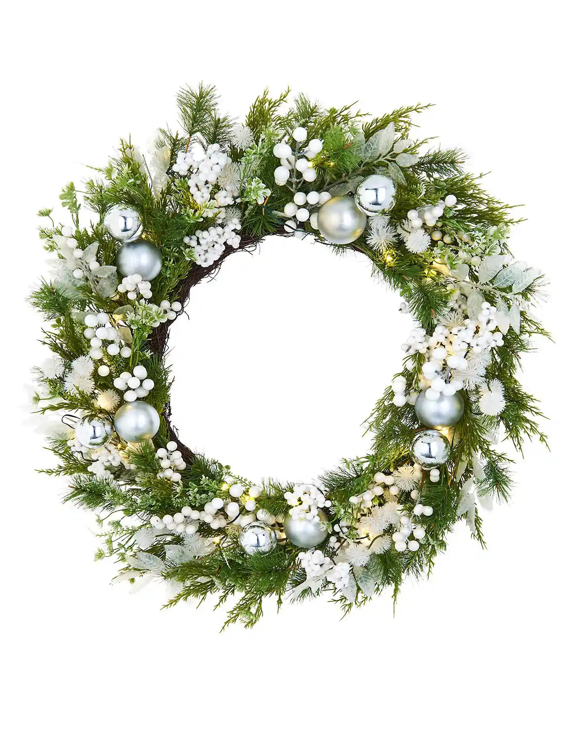 Decorative Christmas wreath with greenery, white flowers, and silver baubles on a white background