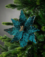 Decorative Turquoise Poinsettia
flower on a Christmas tree