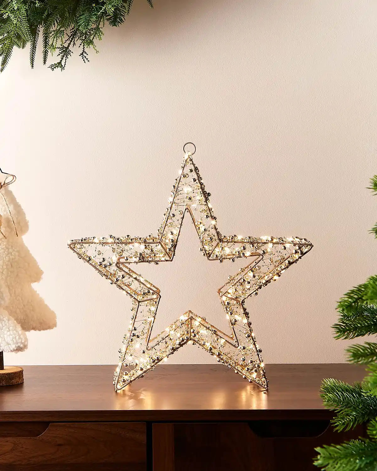 Decorative star light on a table with a neutral background