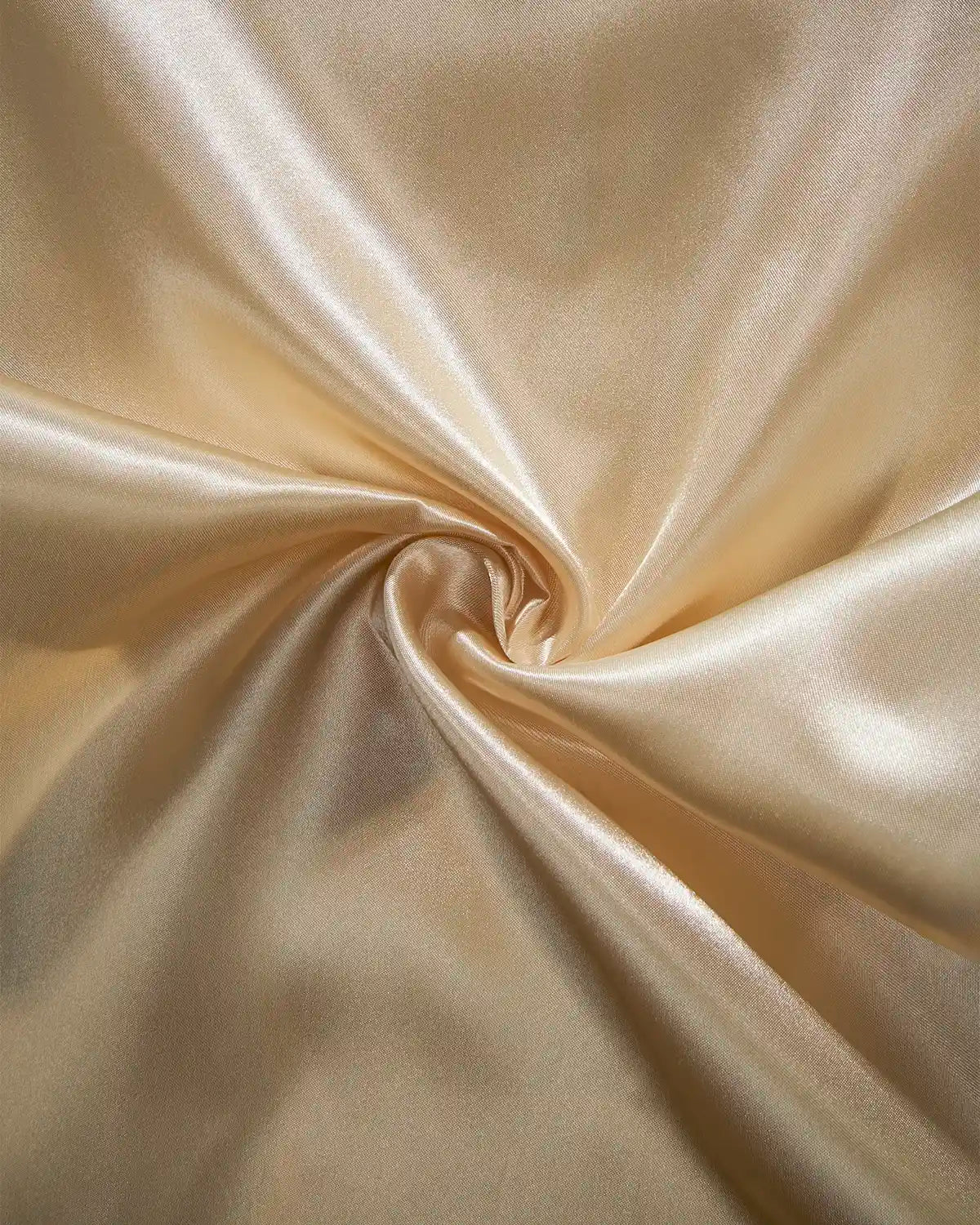 Close-up of latte satin fabric with a swirl pattern