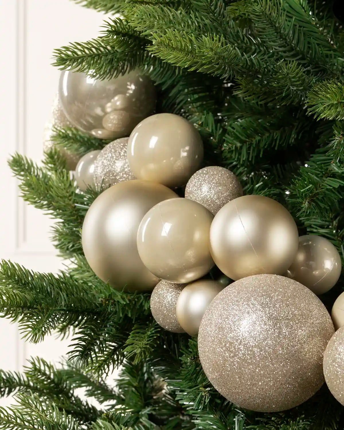 Close-up of Latte Bauble Garland featuring latte, glitter and metallic baubles