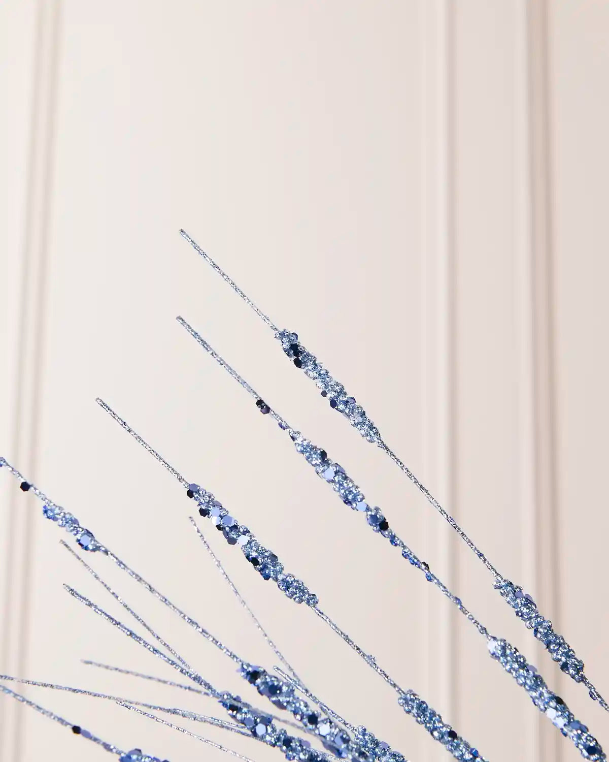 Detailed close-up of slender Ice Blue glitter stems with textured sections from the Glitter Wispy Spray