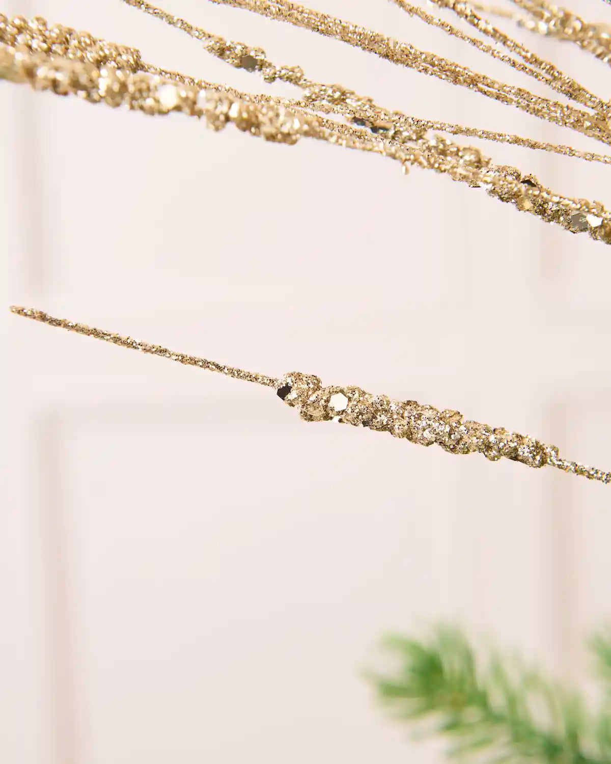 Detailed close-up of slender Latte glitter stems with textured sections 