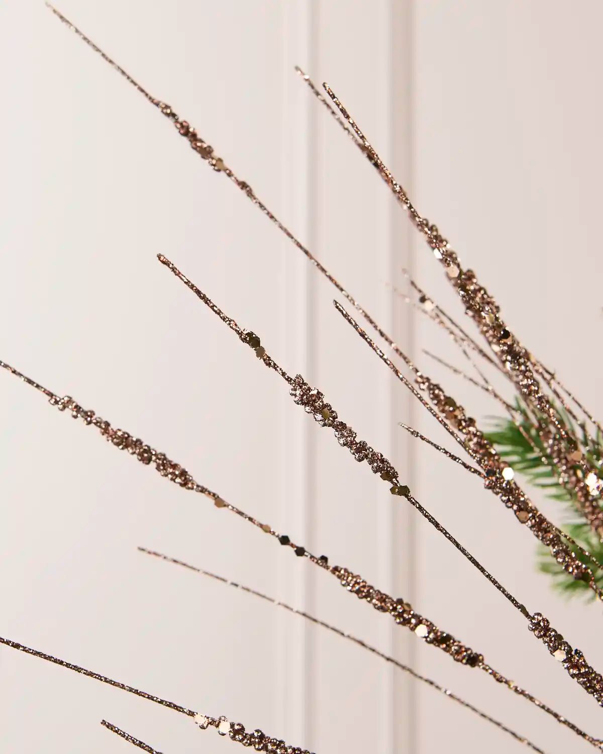 Detailed close-up of slender Mocha glitter stems with textured sections from the Glitter Wispy Spray