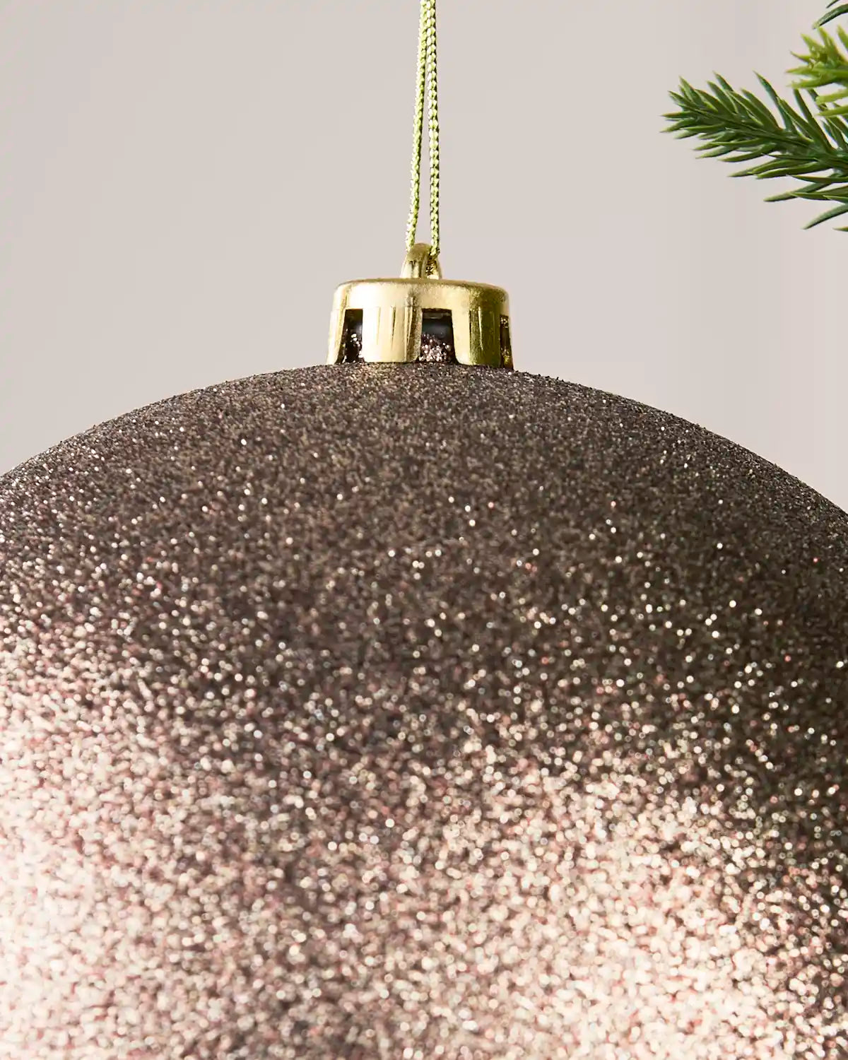 Detailed close-up of the Glitter 20 cm Mocha shatterproof bauble with its gold cap and matching hanging string.