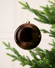 Espresso 15 cm oversized Shiny shatterproof bauble hanging on a Christmas tree with a gold cap and matching string.
