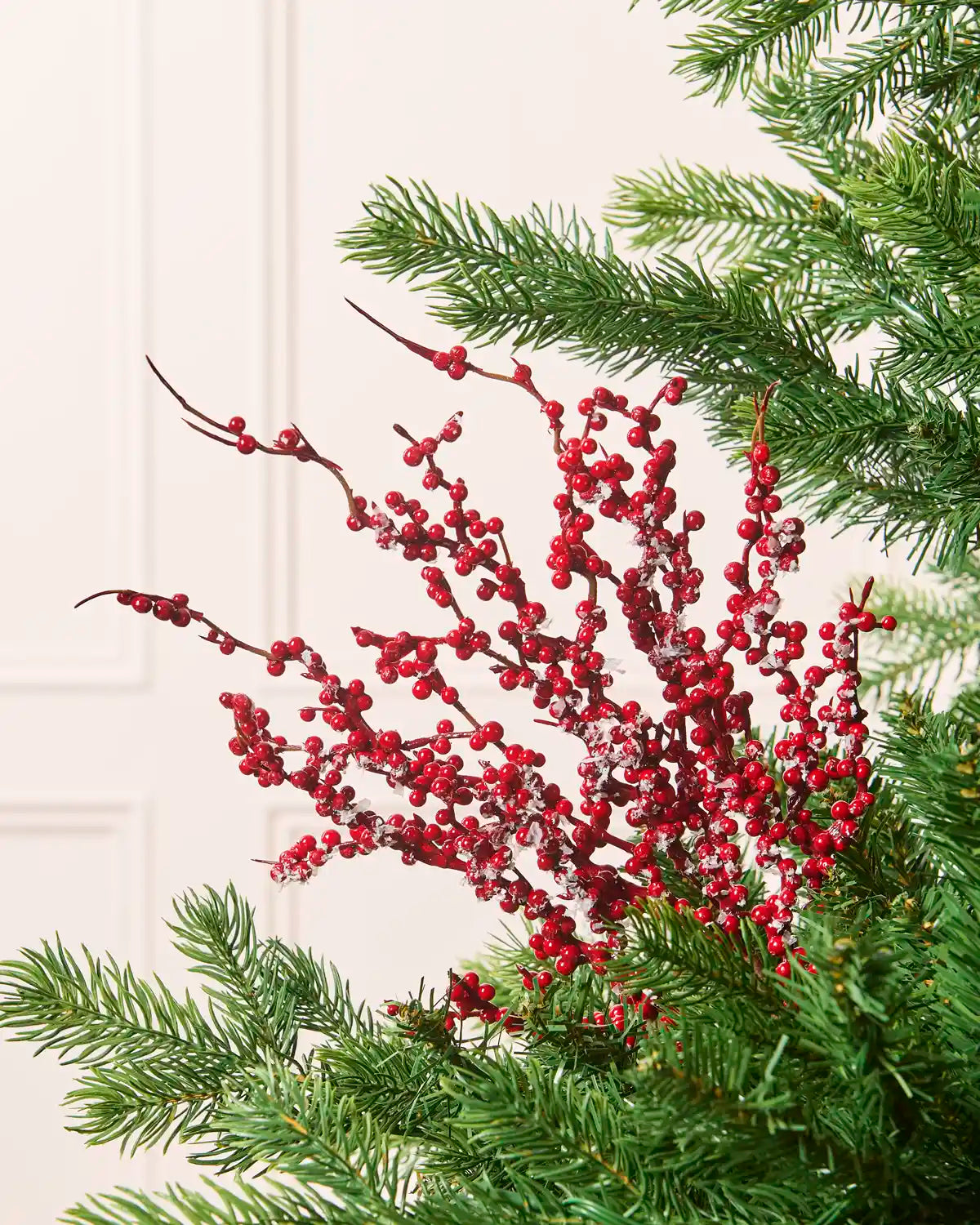 Frosted red berry Christmas tree pick with clusters of glossy red berries and white frosted accents on branching stems.
