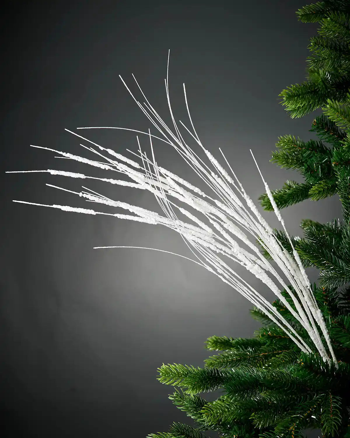 Full image of 100cm white glitter wispy tree spray in Christmas tree in front of white background