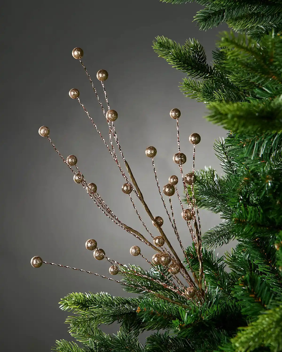 Gold Glitter Berry Christmas Tree Spray on a grey background