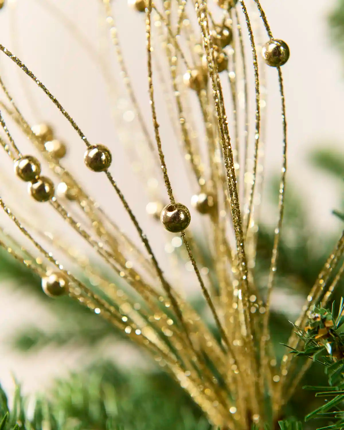 Gold Glitter Nest Christmas Tree Pick showing the glitter details and Gold balls
