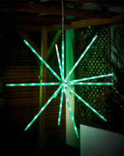 Green LED star-shaped light fixture against a dark background