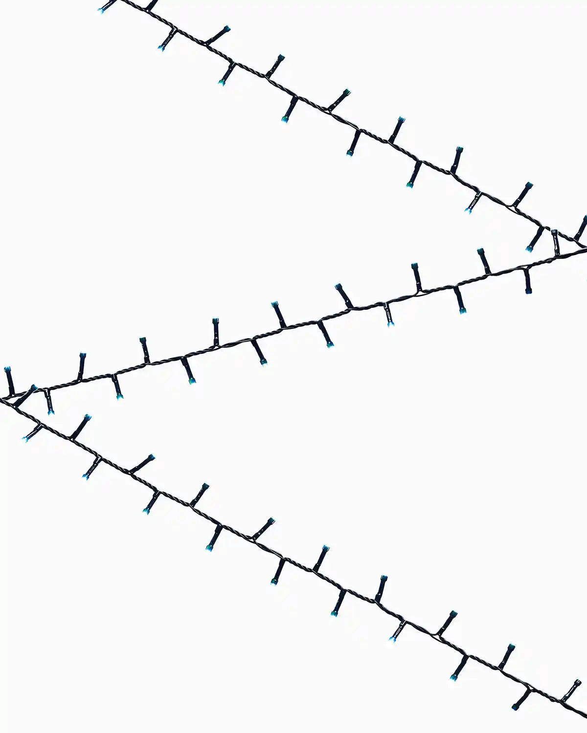 Ice white fairy lights on a white background in the shape of a zig zag