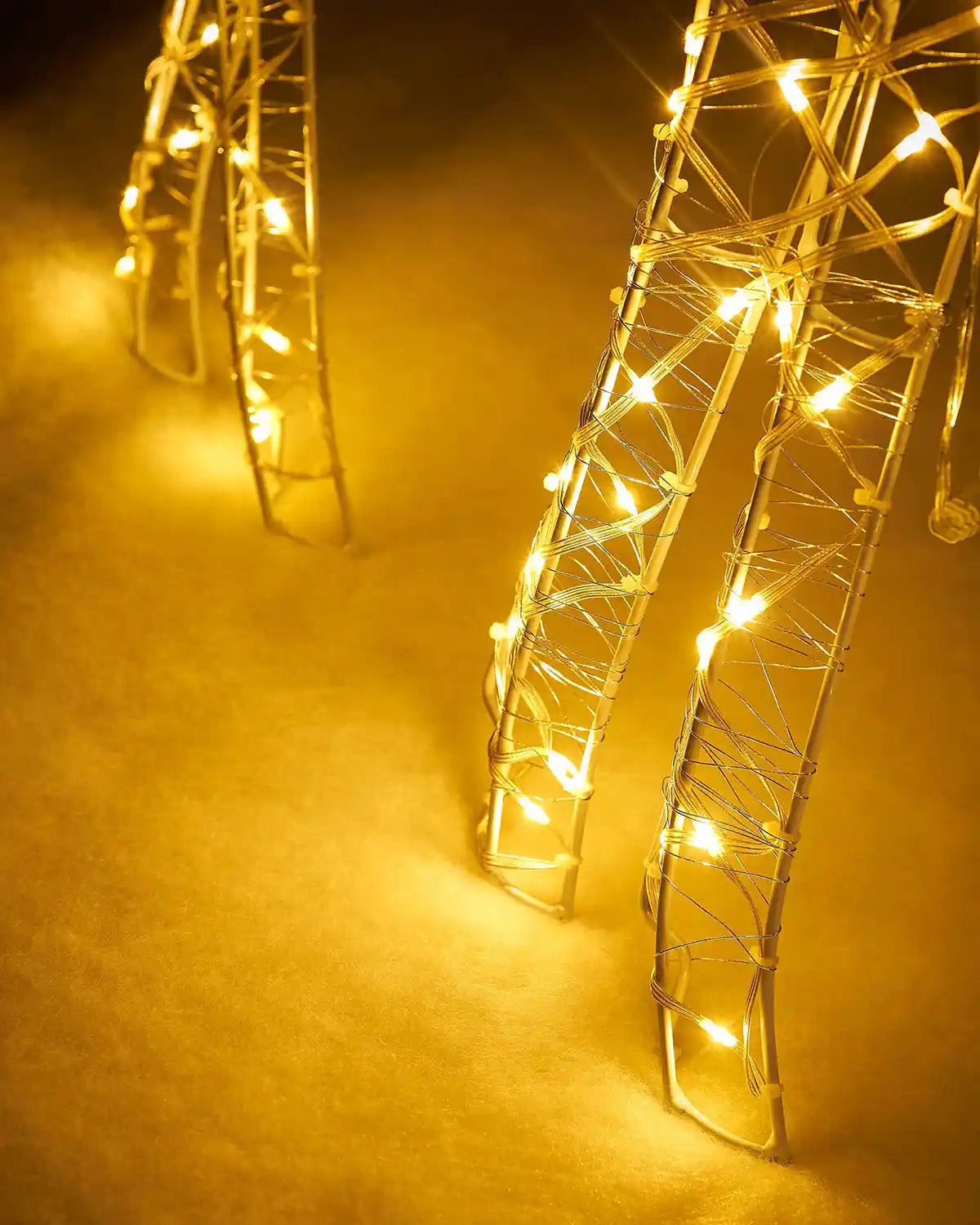 LED reindeer leg on a snowy garden floor