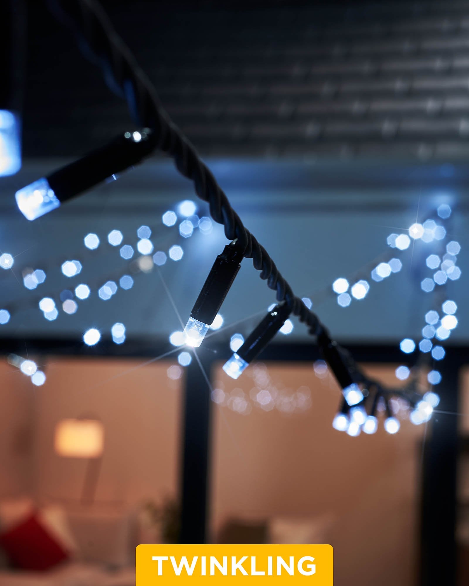 Close-up of white LED string lights with a focus on the 'TWINKLING' feature, showing the lights in an on and off state, creating a twinkling effect.