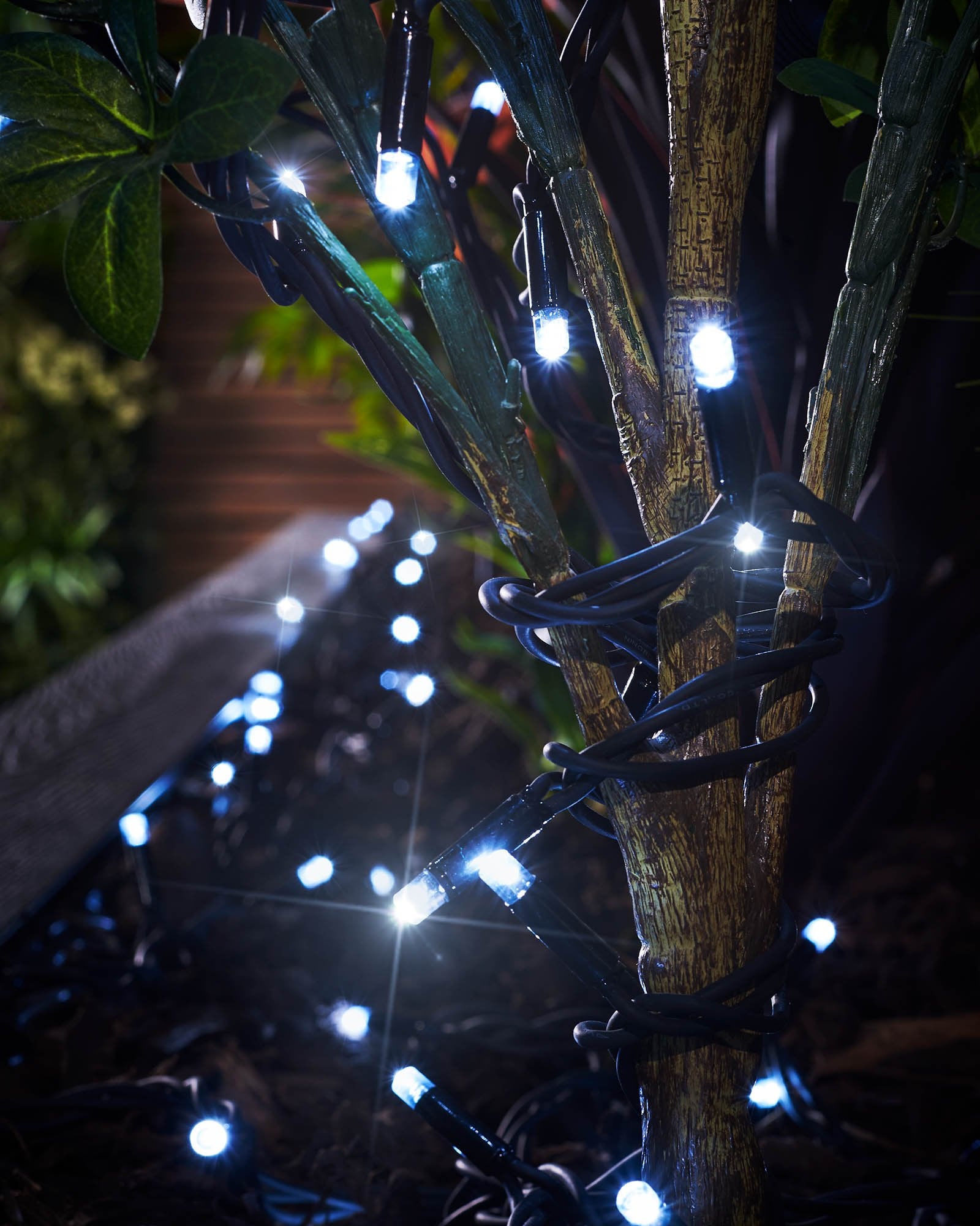 Close-up of white LED string lights with a focus on the 'TWINKLING' feature, showing the lights in an on and off state, creating a twinkling effect.