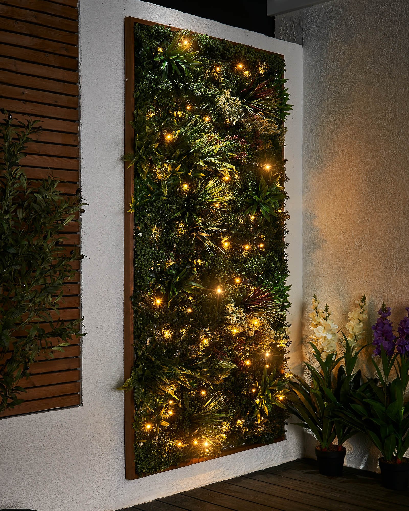 Close-up of warm white LED Christmas string lights with a focus on the twinkle or flashing feature, displayed against a blurred background of similar lights creating a cozy, festive atmosphere.