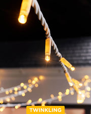 A close-up of connectable twinkle string lights with a focus on the LED bulbs, showcasing the twinkling feature.