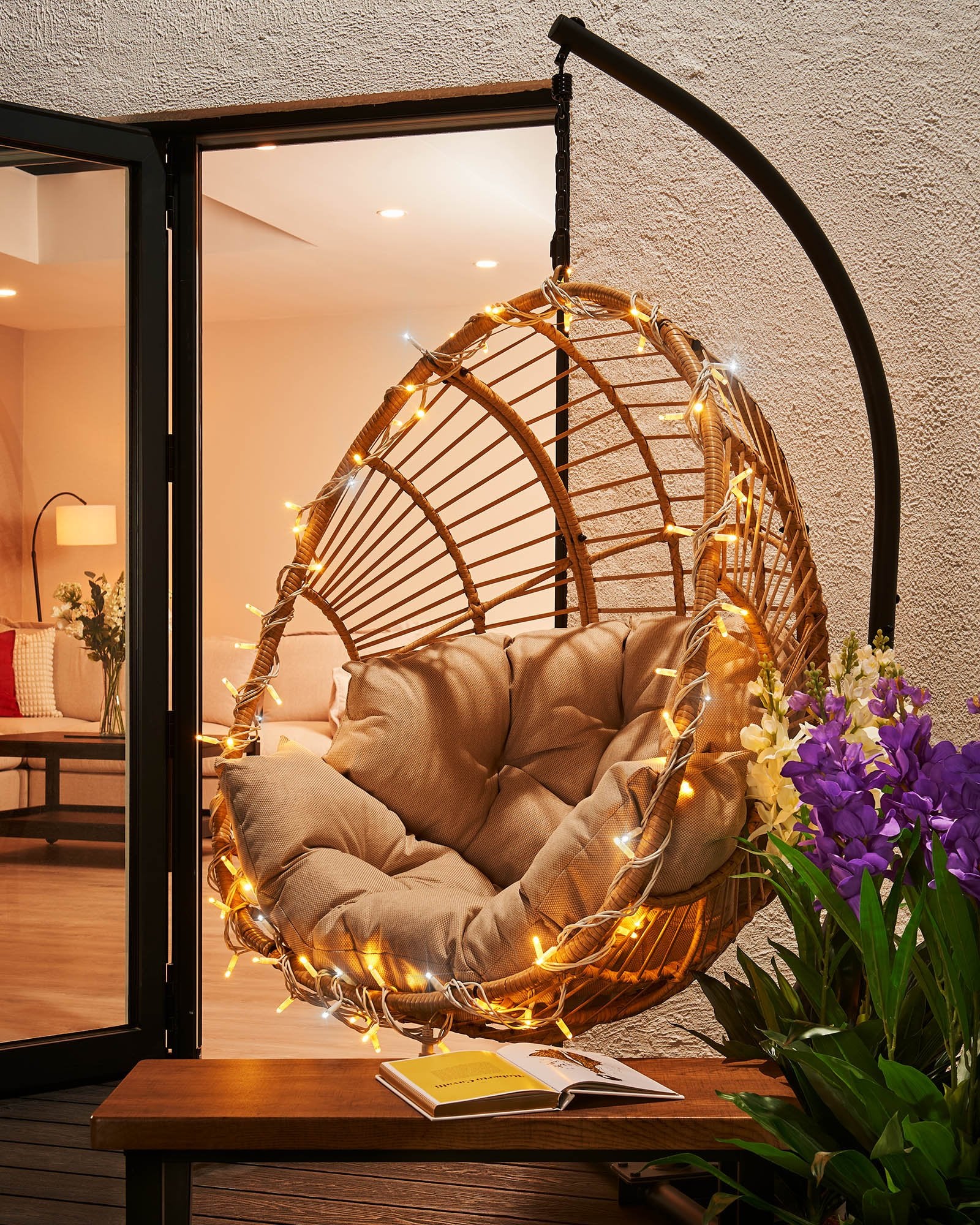 Close-up of connectable twinkle string lights with warm white and white LEDs, showcasing the twinkle effect. The image is taken during the evening with a blurred background.