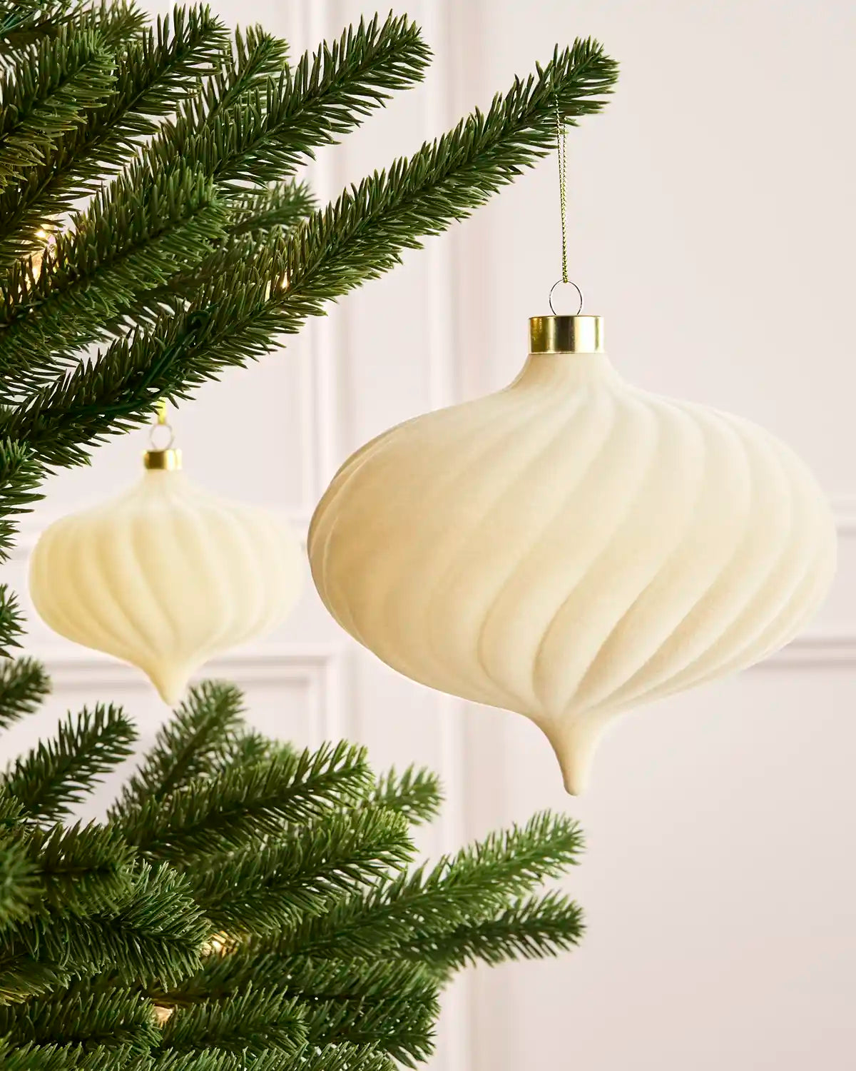 Latte 15 cm oversized velvet Spiral bauble displayed on a Christmas tree with coordinating ornaments.
