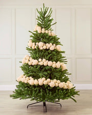 Latte Velvet Bauble Garland decorating a Christmas tree, featuring latte velvet baubles arranged along the garland