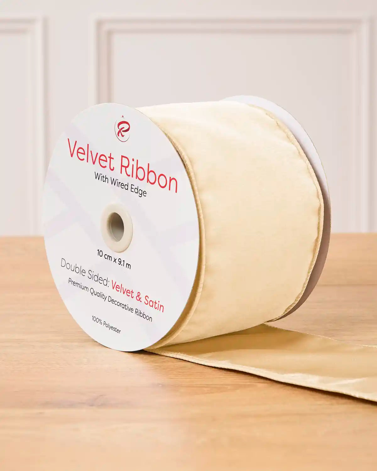 Latte Velvet Ribbon with wired edge on a wooden surface
