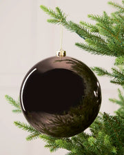 Mocha 20 cm oversized Shiny shatterproof bauble hanging on a Christmas tree with a gold cap and matching string.
